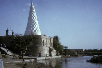 The traditional tomb of Daniel stands in Sush beside the muddy River Ulai*