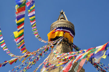Tibetan prayer flags flutter gaily in the breeze*