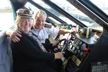 Captain Bill Edgar and my wife share the steering.*