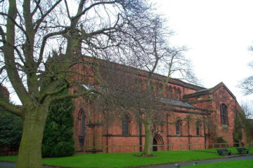 The church of St John the Baptist is constructed of the local red sandstone*