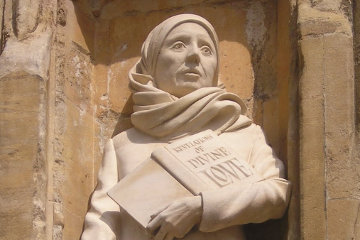 Dame Julian of Norwich clutches her famous book