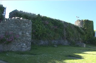 The walls of the Roman fort still guard the church yard*